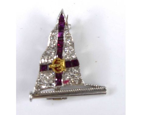 A white metal, ruby and diamond naval brooch, arranged as the flag of St George set with a crown, having twelve channel set p
