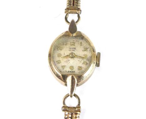 A lady's vintage Tudor Royal 9ct gold cased manual wind wristwatch, having signed Arabic dial, Rolex case, dia.15mm, on a 9ct