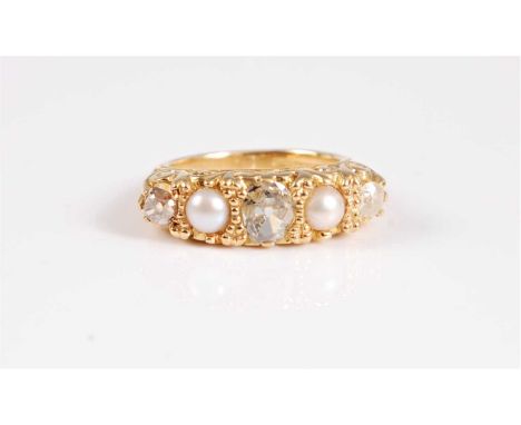 An 18ct gold diamond and split pearl ring, the central old mine cut diamond, set to either side with a split pearl and an old
