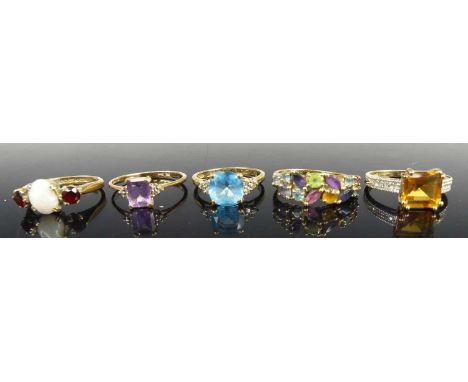Five various 9ct gold precious and semi-precious set dress rings, to include an emerald cut citrine and diamond point example