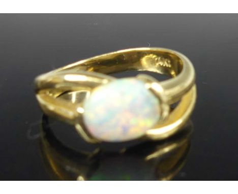 A modern 14ct gold opal set dress ring, the cabochon opal measuring approx 8.4 x 6.9 x 2.5mm, on open shoulders, size N, 4.2g
