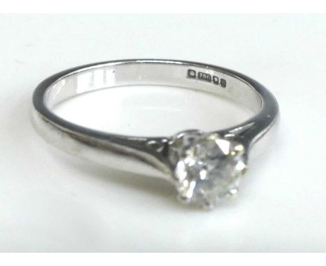 An 18ct white gold diamond solitaire ring, featuring a round brilliant cut diamond in a claw setting, diamond dimensions appr