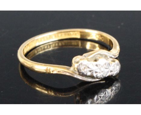 An 18ct gold diamond crossover ring featuring 3 single cut diamonds in illusion settings. Diamond diameters 1.15mm each appro