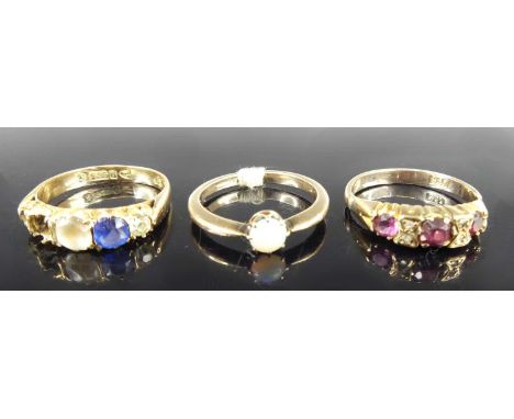 A 9ct gold ruby and diamond set half-hoop ring, size N; together with a 9ct gold cabochon opal set ring, size L; and a 9ct go