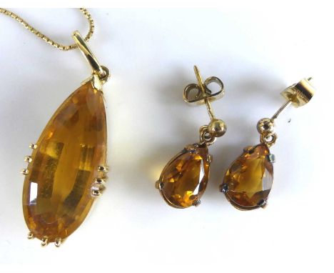 A pair of 9ct yellow gold citrine drop earrings, each with a pear cut citrine in claw setting suspended below bead post and s