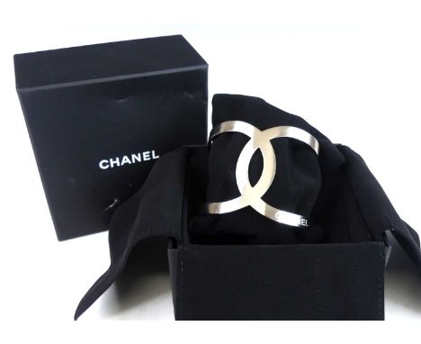 A Chanel-CC logo open cut-out B17V cuff bangle, in matt white metal, unmarked but tests as silver, dia.6.5cm, with box