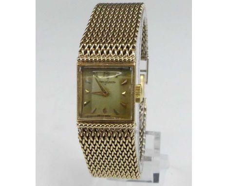 A vintage lady's Jaeger LeCoultre bracelet watch, having a signed champagne dial with baton markers, manual wind movement num
