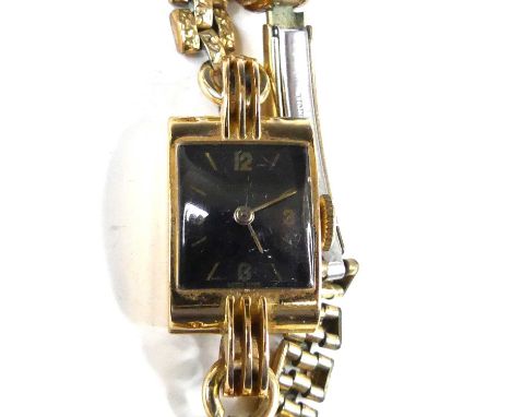 A lady's Art Deco 18ct gold cased tank watch, having an unsigned black dial with quarter Arabic numerals, baton markers, the 