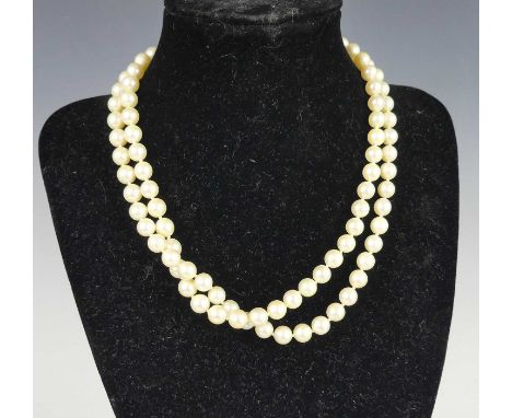 A cultured pearl double-string choker, as knotted cream uniform pearls, diameters each approx 6.8mm, with 9ct gold seed pearl