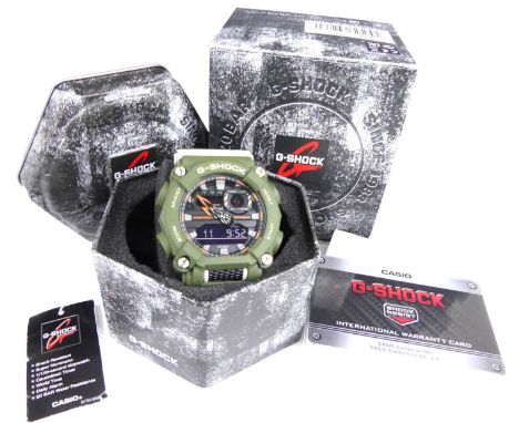 A gent's Casio G-Shock quartz wristwatch, model No.5637, with green plastic case with grey detail, green plastic bracelet, wi