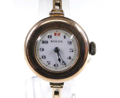 A vintage lady's Rolex 9ct gold cased wristwatch, having signed white enamel Arabic dial with gilded dot minute markers, unsi