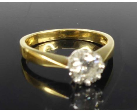 An 18ct gold diamond solitaire ring, the claw set round brilliant having stated weight of 0.5 carats, clarity assessed as SI1