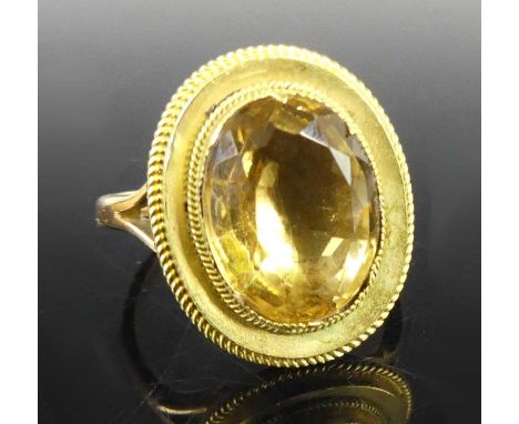 A 9ct gold and citrine set signet ring, the oval cut citrine measuring approx 13.2 x 10.2mm, in a closed back setting, size N