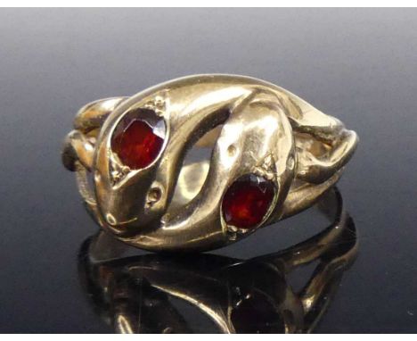 A gent's 9ct gold snake ring, formed as two entwined snakes, the heads each set with an oval cut garnet, size U, 4.6g