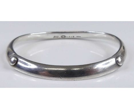 A Vivianna Torun Bulow-Hube for Georg Jensen button pattern single bangle, design no 440, stamped to interior, dia. 7cm, 3.9g