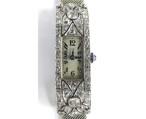 An Art Deco white metal and diamond manual wind Vetex 17-jewel wristwatch, having a silvered tank Arabic dial and case grain 