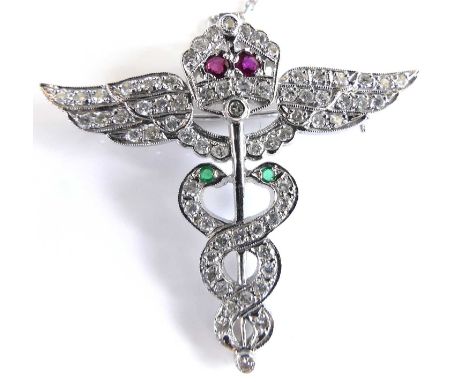 A 14ct white gold Princess Mary's Royal Air Force Nursing Service brooch, set with 68 round brilliant cut diamonds, two rubie