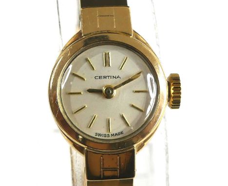 A 9ct yellow gold Certina manual wind wristwatch, having a round cream baton dial and integral brick-link bracelet with ladde