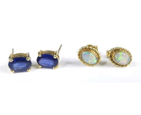 A pair of modern 18ct gold and cabochon opal set ear studs, each with a ropetwist border, 8.2 x 6.5mm, 1.8g; together with a 