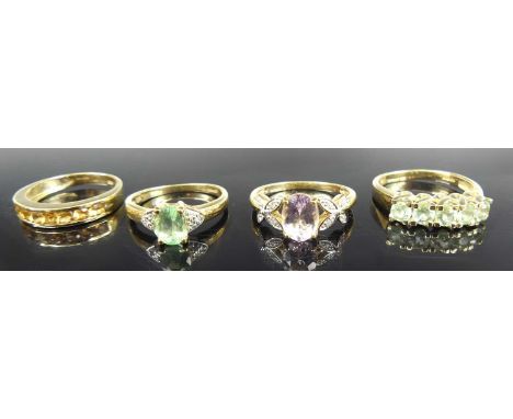 A modern 9ct gold Brazilian paraiba tourmaline and diamond point set dress ring, the oval cut tourmaline weighing approx 0.62