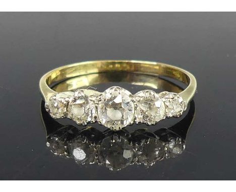 A yellow and white metal diamond half eternity ring, featuring five graduated Old European cut diamonds in claw settings, dia