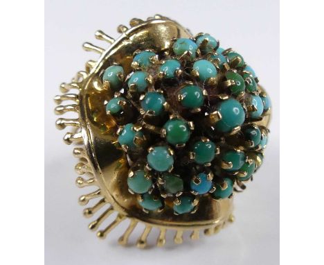 A continental mid 20th century 18ct gold and turquoise set dress ring, the boss setting with numerous four claw turquoise cab