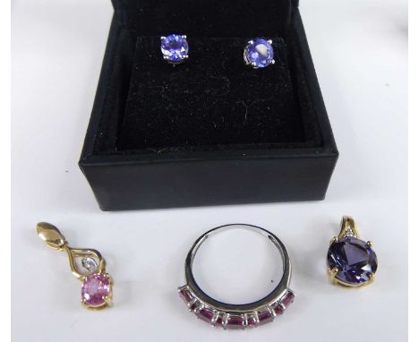 A pair of modern 18ct white gold tanzanite set ear studs, the four-claw set round cut tanzanite weighing approx 1.25 carats; 