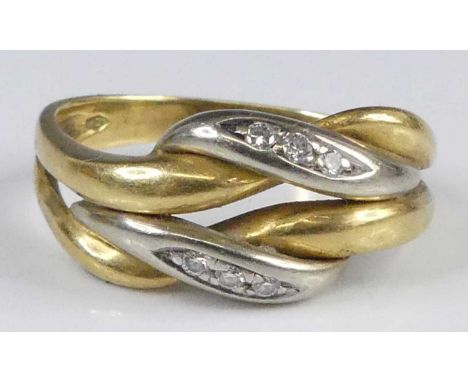 A contemporary continental 18ct gold and diamond set knotted band ring having two raised white metal intertwined bands, each 