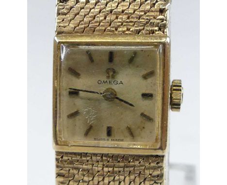 An Omega lady's 9ct gold bracelet watch, circa 1970s, having a square Roman signed dial, manual wind movement, and on integra