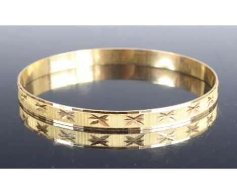 A modern 18ct gold and bright cut engraved bangle, sponsor RAF, 13.1g, dia.6.7cm