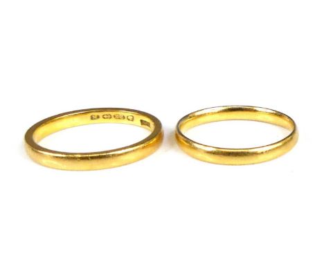 A 22ct gold court shaped wedding band, size K, band w.22mm; together with another similar example, size J, gross weight 4.8g 