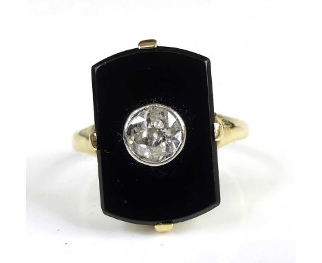 A yellow metal black onyx and diamond dress ring, featuring an Old European cut diamond bezel set in the centre of a 16.35 x 