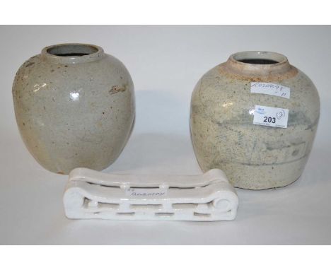Two Chinese pottery jars, one with a smokey grey decoration together with a Chinese porcelain head rest