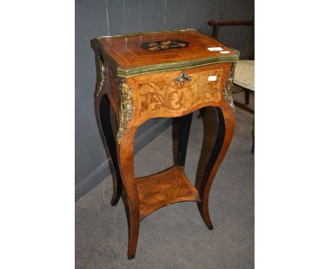 A small 20th Century French floral inlaid and brass mounted sewing table or storage box with hinged lid, cabriole legs and a 