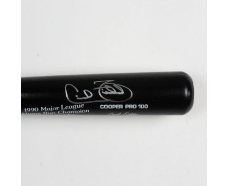 Black and natural wood color with black, yellow, and red banding Pro 100 bat. This bat's design commemorates 1990 Major Leagu