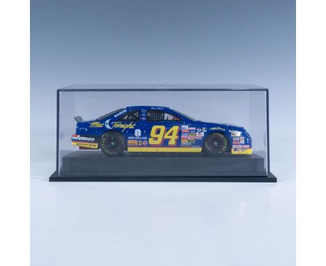 Die-cast metal with plastic parts, 1:24 scale replica of the 1997 racer. This item has a plastic base with removable cover in