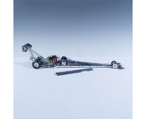 Die-cast metal with plastic parts, 1:24 scale replica of the NHRA racer. It is blue and white and covered with sponsors like 