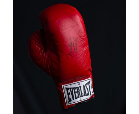 This is an Everlast boxing glove signed with both names Muhammad Ali and Cassius Clay making it very rare. Authenticated by a