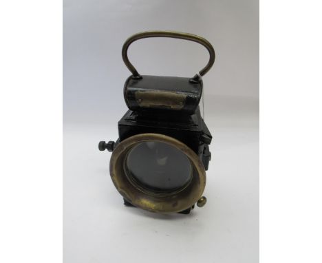 A black painted traction engine headlamp with interior