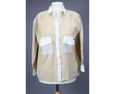 A Vintage Mary Quant ladies’ blouse of cream ground with white trimmings (size 16).