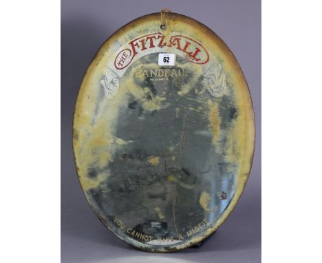 A vintage oval frameless wall mirror “BANDEAU THE FITZALL, YOU CANNOT HAVE A MISFIT”, 17¾” X 14¼”.
