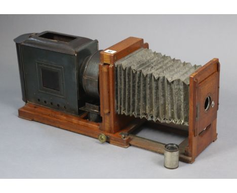 An early 20th century steel &amp; mahogany magic lantern, 17” wide; &amp; a Kewmode film-video machine, boxed.