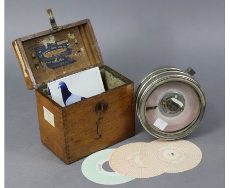 A mid-20th century “Toulet Imperator” (Belgian) pigeon racing clock in silvered-metal case, 6¾” diam. &amp; with oak carrying