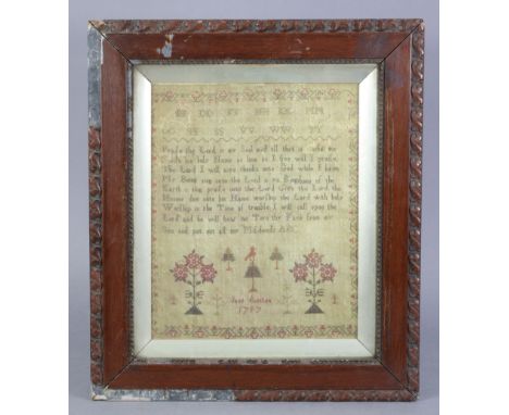 A facsimile of a JANE AUSTEN needlework sampler dated 1797, in a glazed Victorian frame, 19¼” x 16¾” over-all.