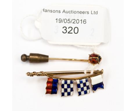 A 9 carat gold stick pin of nautical interest with enamelled flage, together with a yellow metal ladybird stick pin , gross w