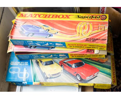 A Matchbox M-2 Motorised Motorway set within original box (not complete), together with three Matchbox SF-4 Double Loop Race 