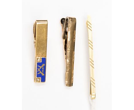 A 9 carat gold tie clip with diamond decoration and a Masonic style enamel back, 6.5 grms approx., together with gilt and sil