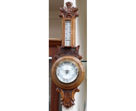 An oak aneroid barometer 