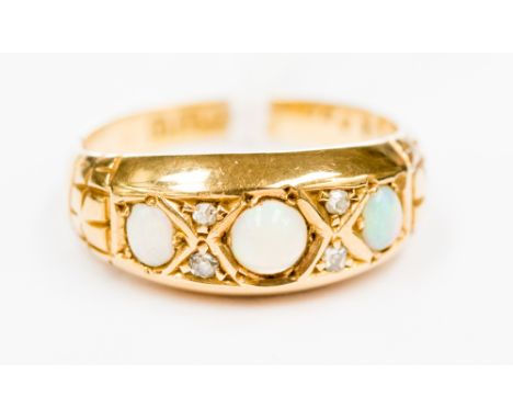 An 18ct gold, opal and diamond ring, size J approx.