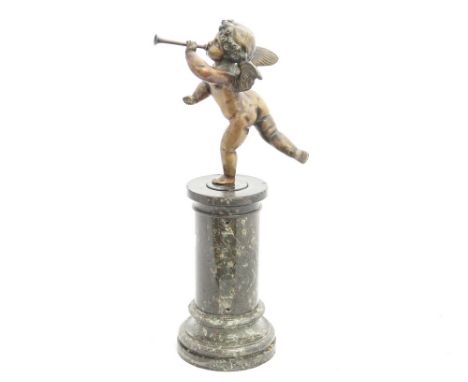 A late 19th Century bronze figure of a cherub playing a horn, on a marble column, 40 cm high approx.